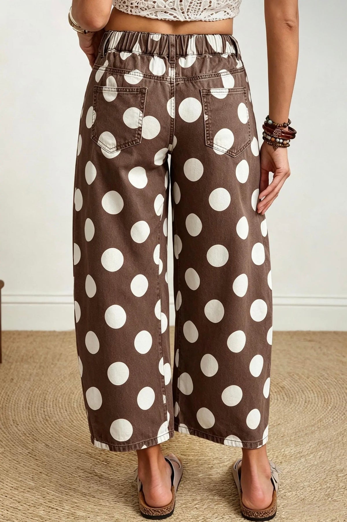 Back view of brown white polka dot jeans with elastic back waistband and rear pockets