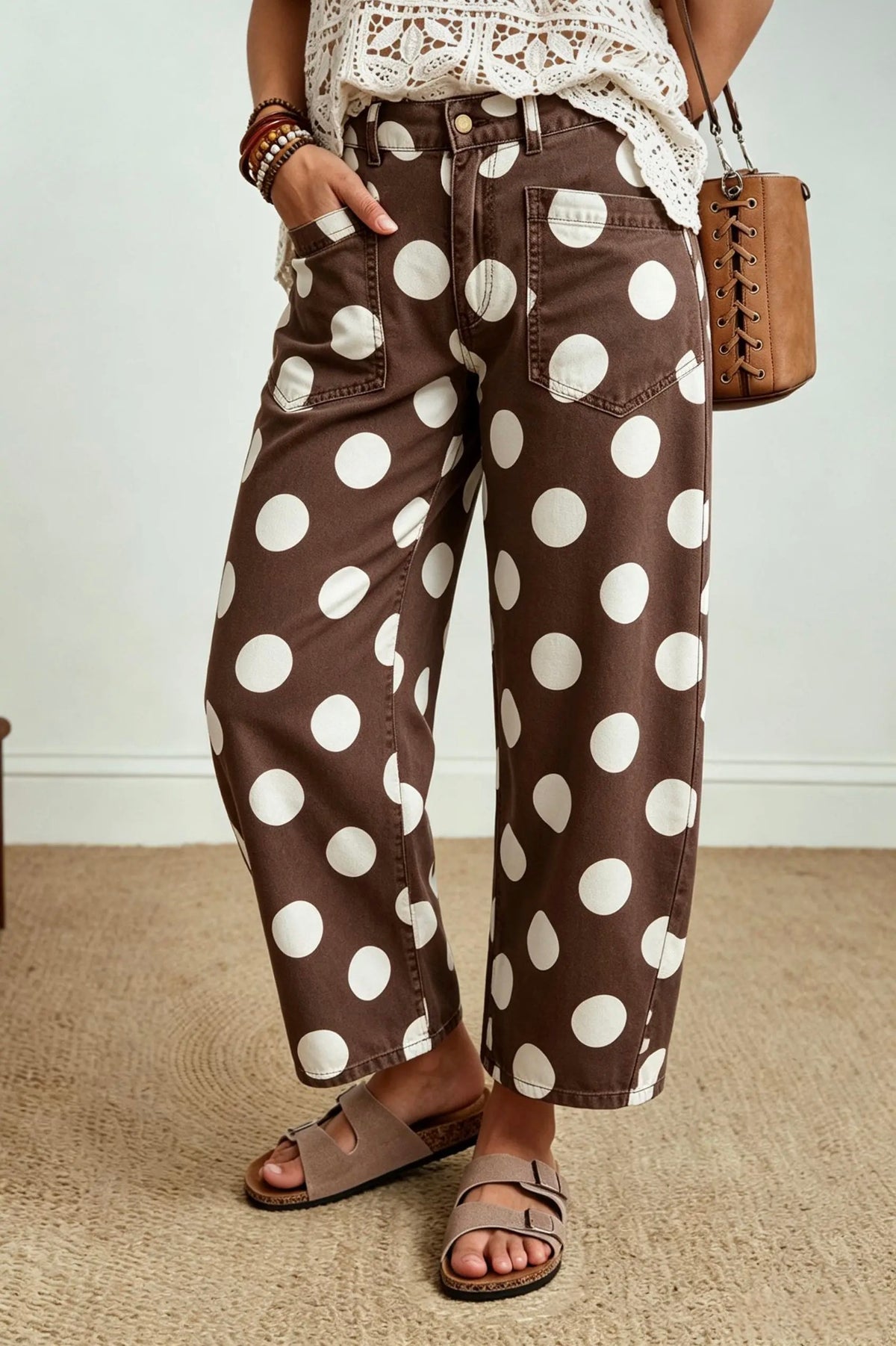 Second front view of brown and white polka dot wide leg jeans