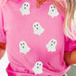 Bright pink short sleeve T-shirt featuring six white ghost graphics