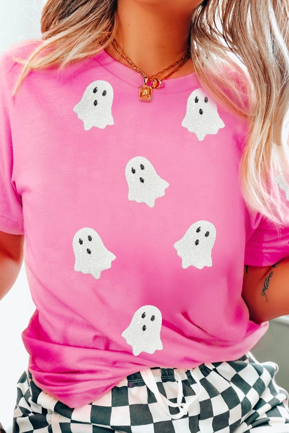 Bright pink short sleeve T-shirt featuring six white ghost graphics
